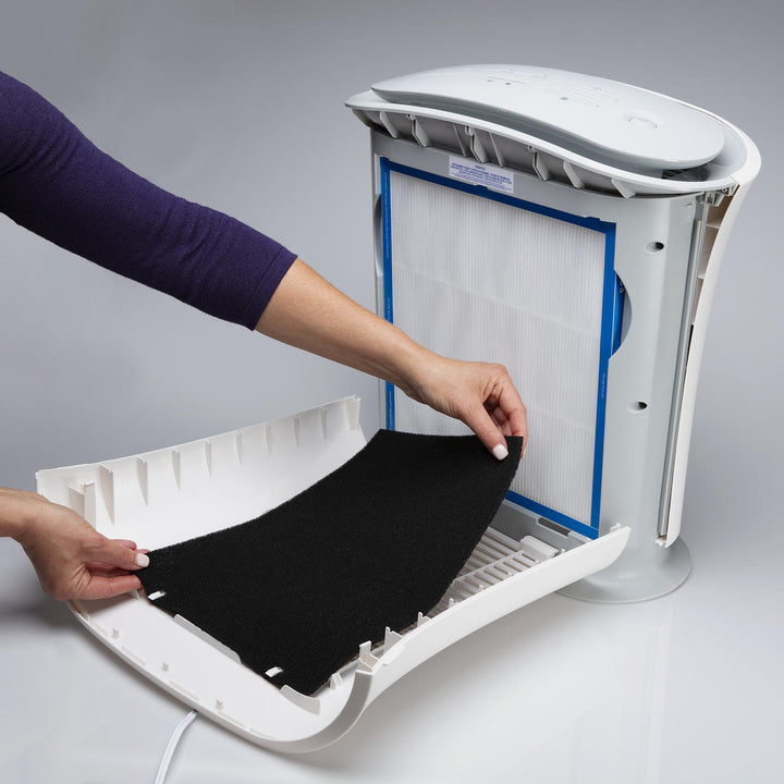 Woman adds Homedics TotalClean Replacement Odor Filter to TotalClean