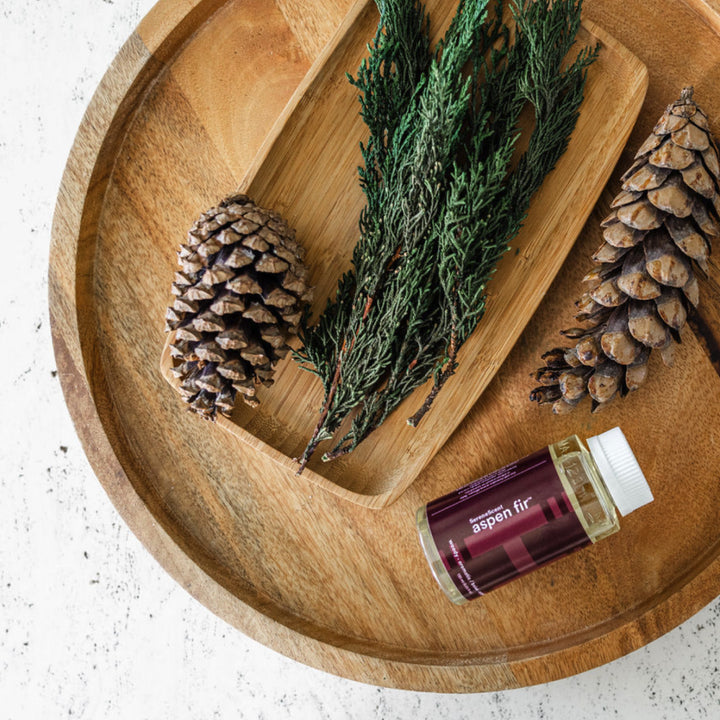 Lifestyle image showing ingredients of SereneScent™ Aspen Fir fragrance.