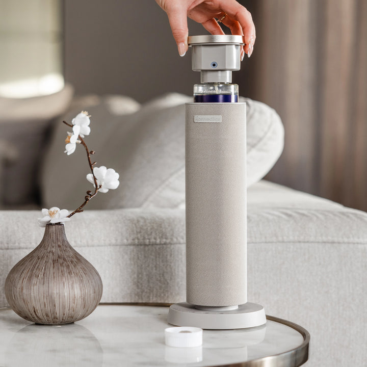 SereneScent™ waterless - diffuser on a table with modern decor.