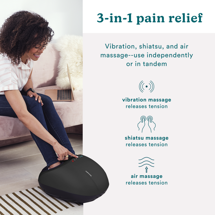 Woman with feet in the Homedics 3-in-1 Pro Foot Massager with Heat adjusts settings