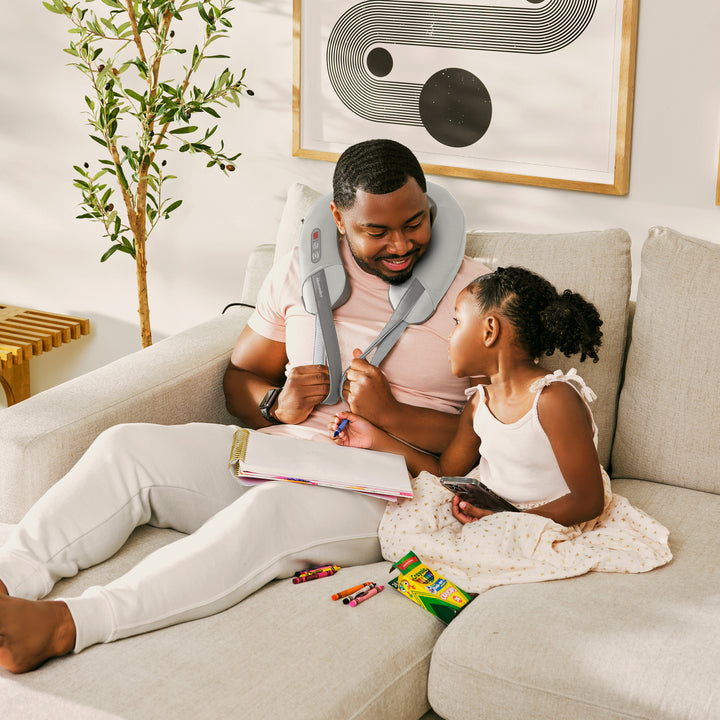 Man relaxing with neck massage from the Homedics Pro Therapy Elite - Shiatsu and Vibration Neck Massager