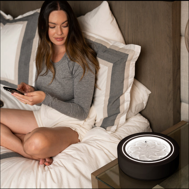 Black | woman winds down in bed while gazing into the drift 11"