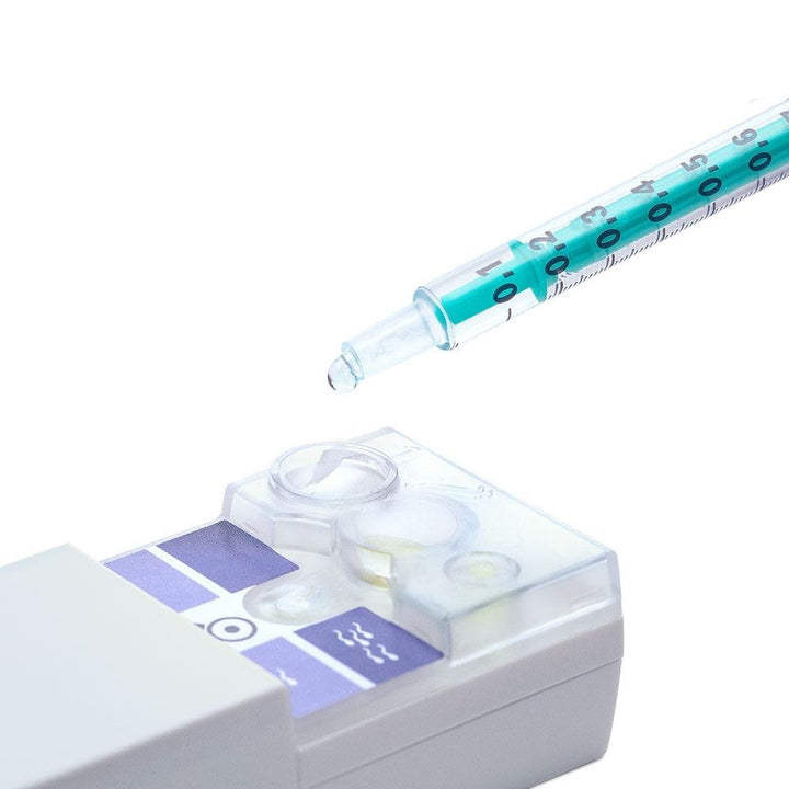Close-up view of the SwimCount Sperm Quality Test testing device with syringe