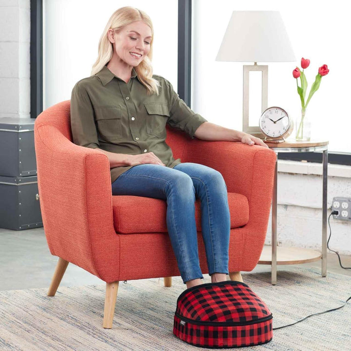 Red Plaid | Woman sitting in chair enjoys massage with the red plaid Homedics Double Duty Shiatsu Massager with Soothing Heat