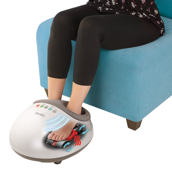 Grey | Woman sits in chair while enjoying a heated massage from the Homedics Shiatsu Air Pro Foot Massager with Heat