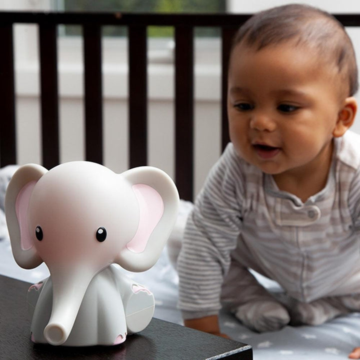 Baby looks at Homedics MyBaby Comfort Creatures Elephant