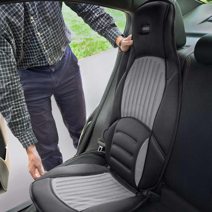 Man places the Homedics Mobile Comfort Perfect Temp Travel Cushion in car seat