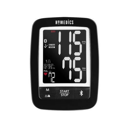 Man sits at table as blood pressure is taken with the Homedics Premium Arm Blood Pressure Monitor