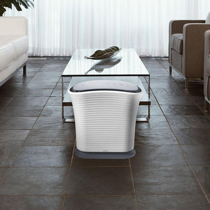Homedics True HEPA Medium Room Air Purifier in living room next to coffee table