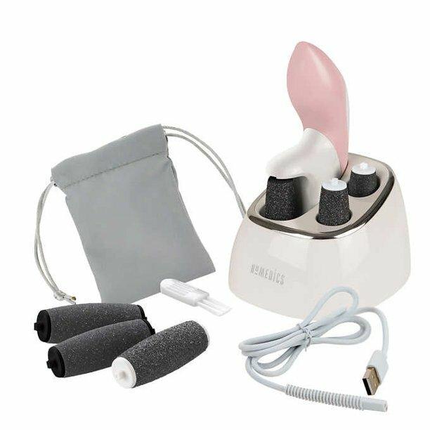 Woman in sits in bathroom while holding the Homedics SoftSilk Rechargeable Pedicure Callus Remover next to foot