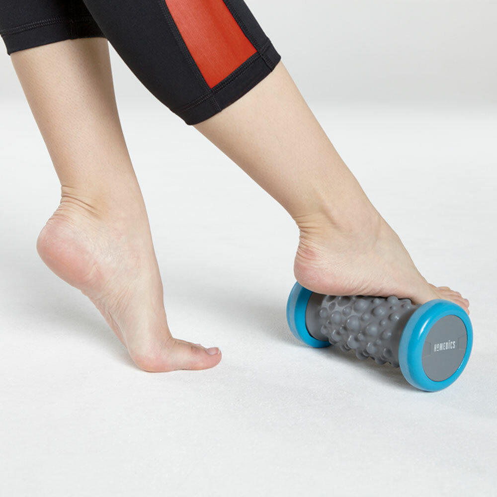 Woman with foot on the Homedics Hydra Vibration Foot Massager