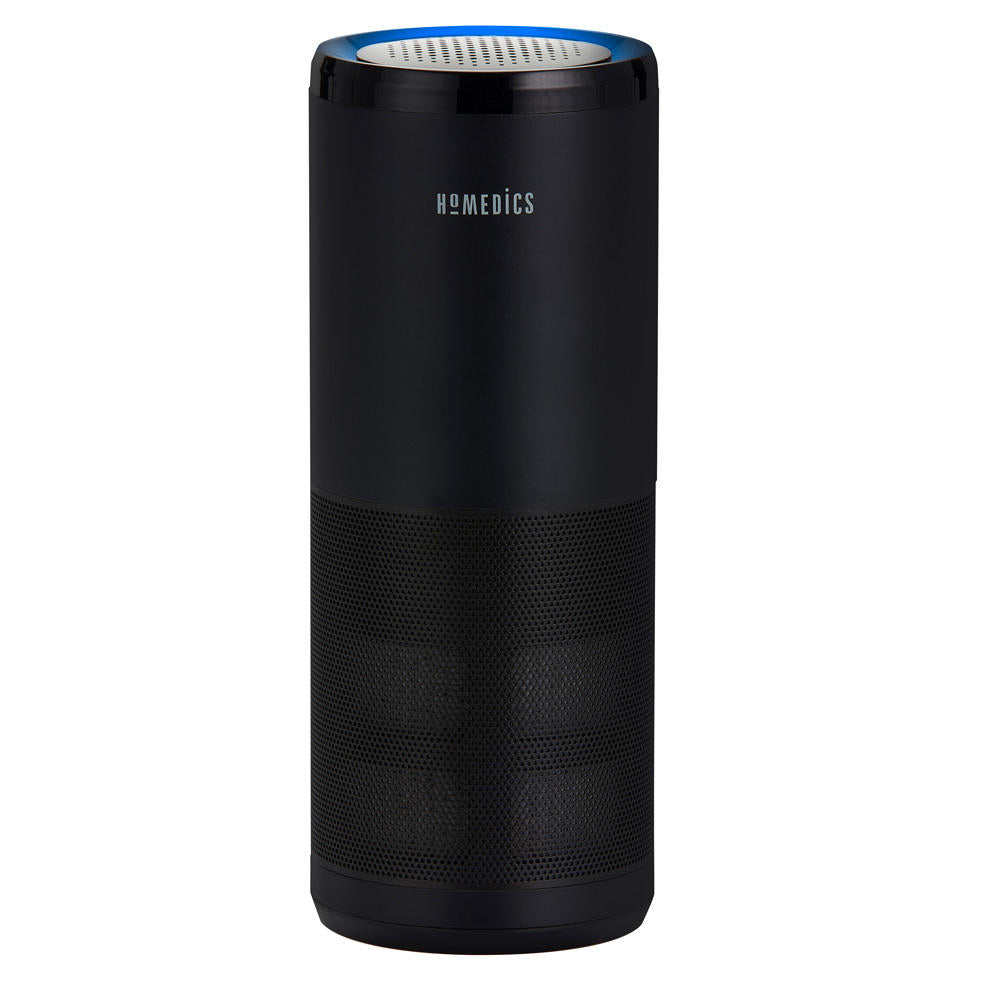 Black | Woman smiles while looking at the Homedics TotalClean 4-IN-1 UV Portable Air Purifier in black on end table
