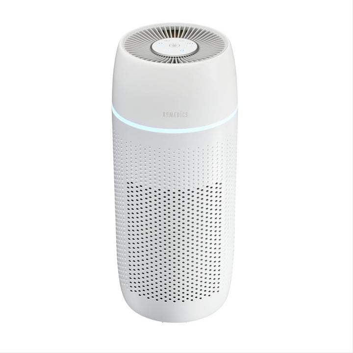 Woman sitting with the Homedics TotalClean PetPlus 5-in-1 Air Purifier that removes 99.97% airborne allergens.