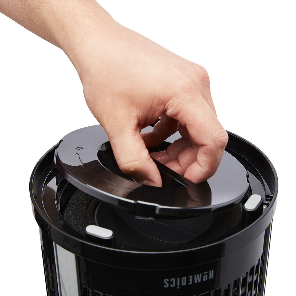 Black | Hand opens air filter compartment on the black Homedics TotalClean 4-in-1 Small Room Air Purifier