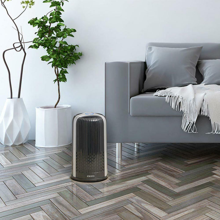 Black | Black Homedics TotalClean 4-in-1 Small Room Air Purifier sitting on living room floor