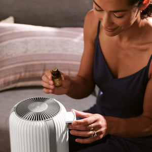 Image shows women with Homedics Air Purifier T12