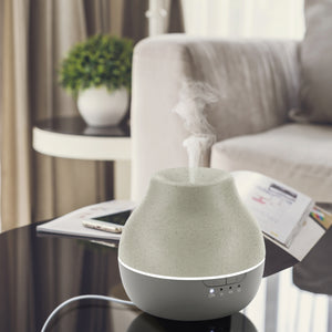 Homedics® Diffuser is kept on centre table and steam is coming out of it.