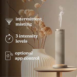 SereneScent™ Fabric Waterless Diffuser placed on table with featured displayed like intermittent misting, 3 intensity levels and optional app control