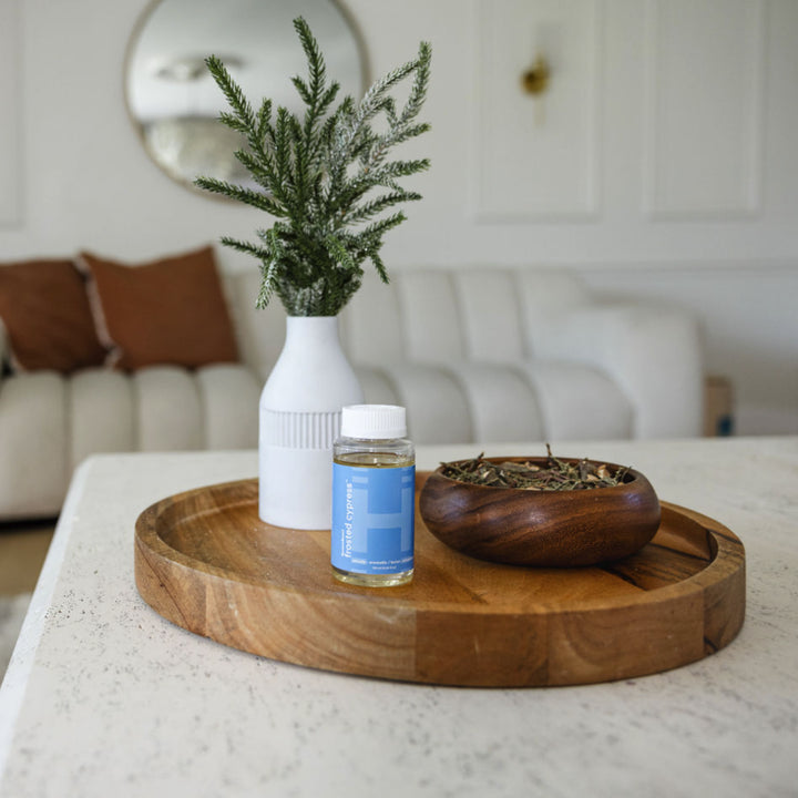 Lifestyle image showing ingredients of SereneScent™ Frosted Cypress fragrance.
