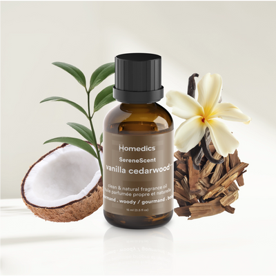 SereneScent™ Vanilla Cedarwood fragrance oil bottle with coconut, flowers, and wood elements on a light background