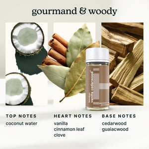 Bottle of vanilla cedarwood with coconut, cinnamon, and wood elements on a white background