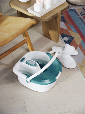 Slippers next to Bubble Spa Elite Footbath as it heats up