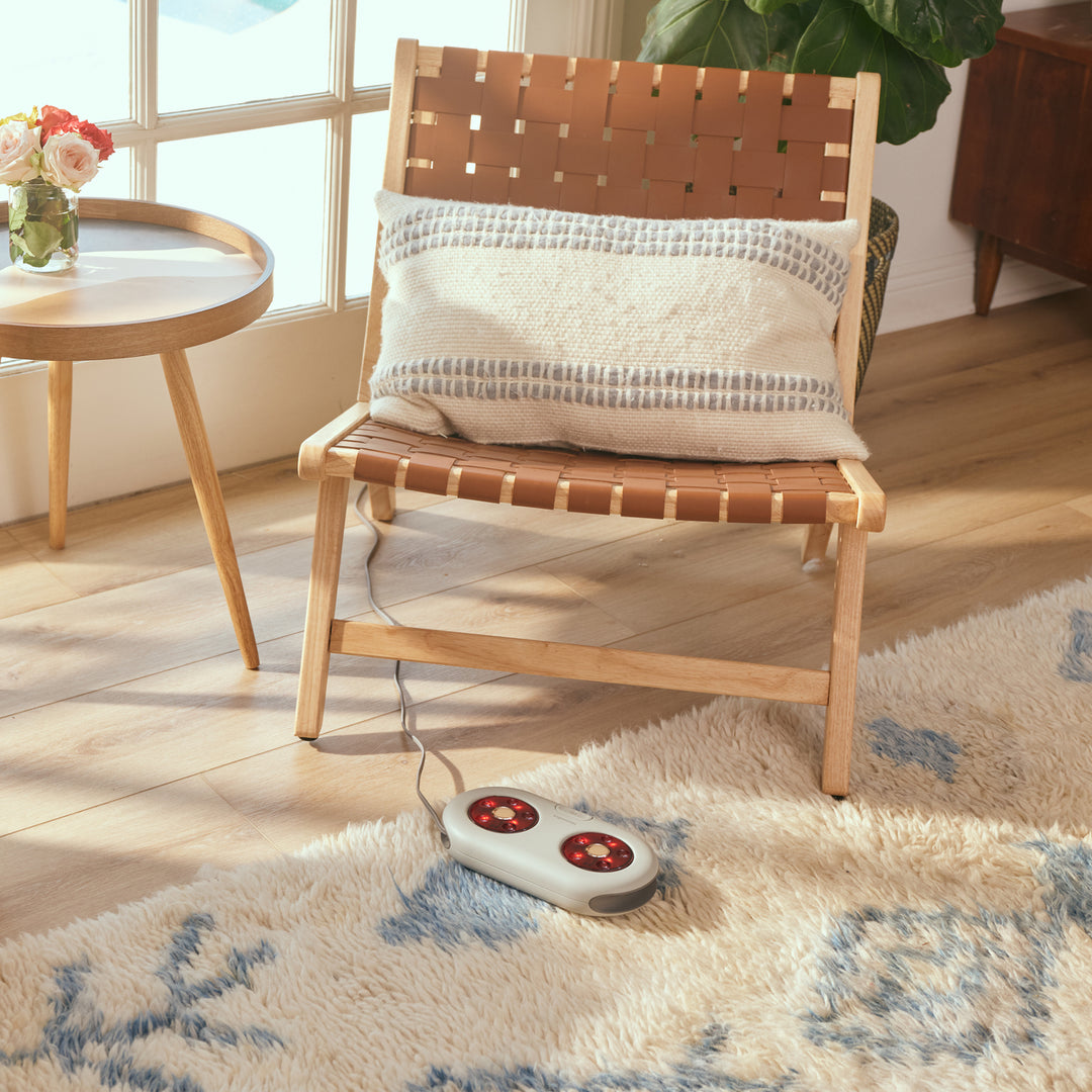 Homedics® MaxComfort Shiatsu Foot Massager with Heat lays flat on the rug, plugged in and ready to use