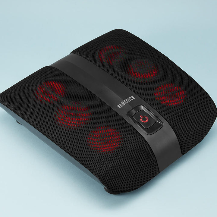 Angled view of the Homedics Triple Action Shiatsu Foot Massager with Heat with rotational heads in red