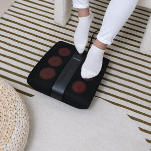 Close up view of woman enjoying a foot massage from the Homedics Triple Action Shiatsu Foot Massager with Heat