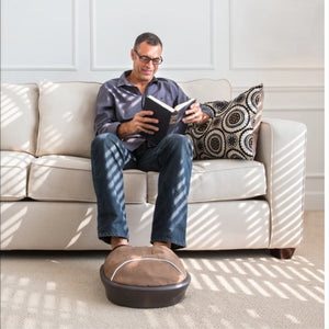 Man sitting on couch using the Air Compression Shiatsu Foot Massager