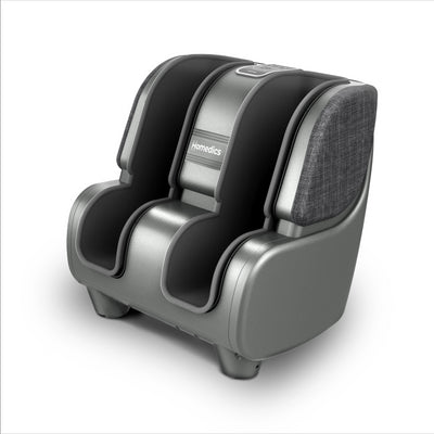 Man sitting on chair while enjoying a massage from the Homedics Deluxe Foot & Calf Massager with Heat