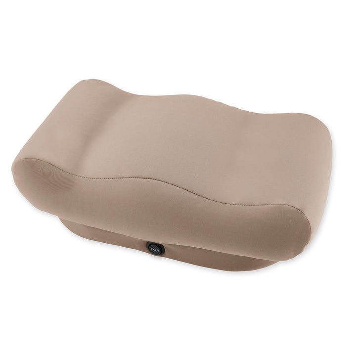 Woman enjoying her morning coffee sitting at a table while massaging her feet with the Homedics Comfy Footrest Massager