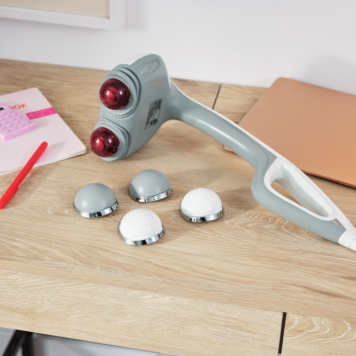 White | White Percussion Action Plus Handheld Massager with Heat and accessories on table