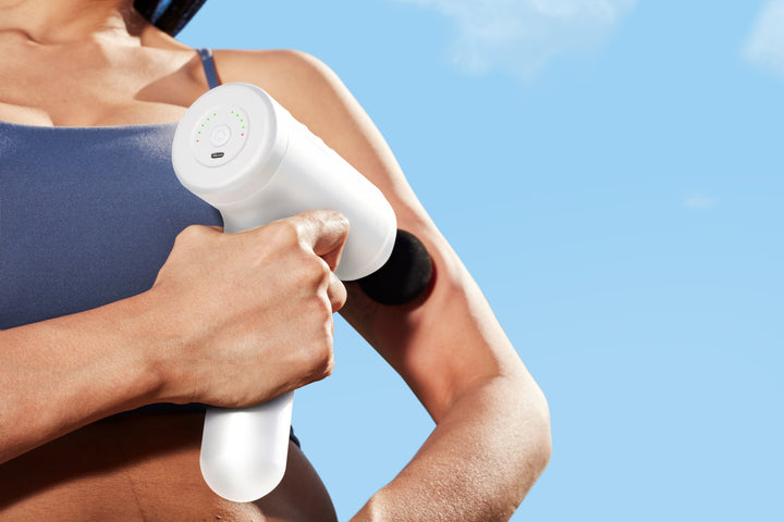 White | Homedics Therapist Select Prime Percussion Massager is used on sore muscles like biceps