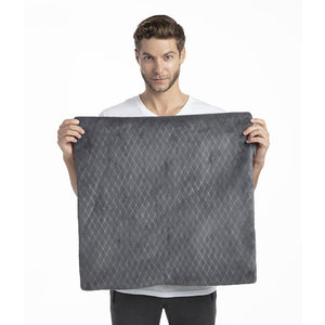 Man holds up the Homedics 24 x 24 Plush Oversized Heating Pad