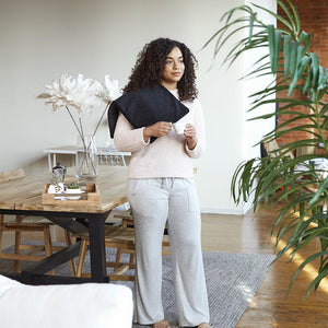 Woman standing with the Homedics 12