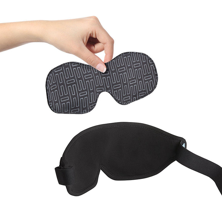 Hand holds removable gel pad for the Homedics Gel Eye Mask with Hot and Cold Therapy