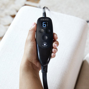 Close-up of hand holding the digital LCD controller for the Homedics Weighted Gel Wrap