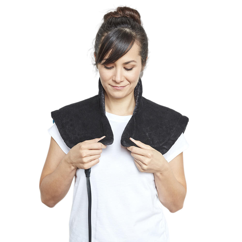 Woman wearing the Homedics Weighted Gel Wrap on shoulders