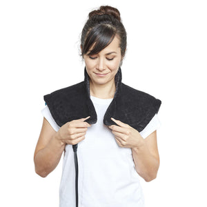 Woman wearing the Homedics Weighted Gel Wrap on shoulders