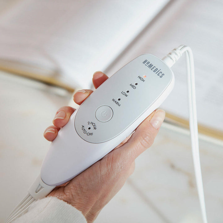 Close-up view of the analog LED controller for the Homedics Women's Health Comfort Heating Belt