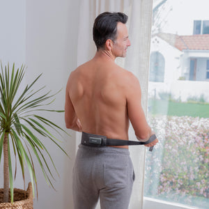 Homedics® Infrared + Red Light Pain Therapy Wrap is providing pain relief on his lower back muscles