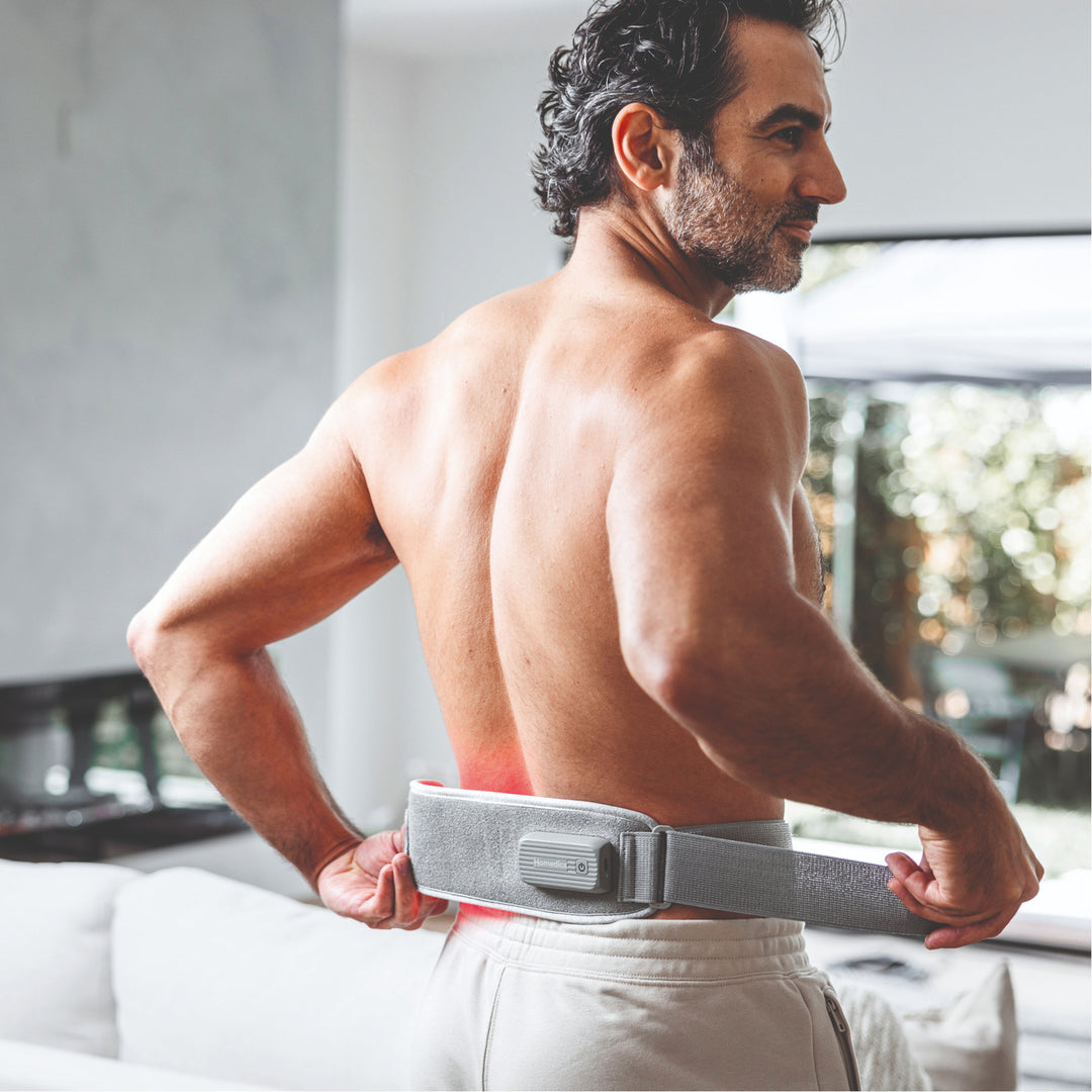 A man using Homedics® Infrared & Red Light Pain Therapy Wrap