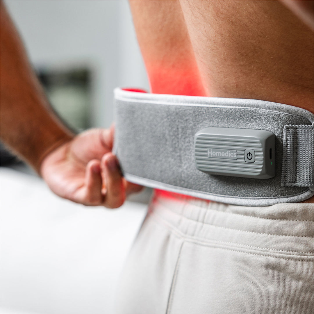 A man using Homedics® Infrared & Red Light Pain Therapy Wrap