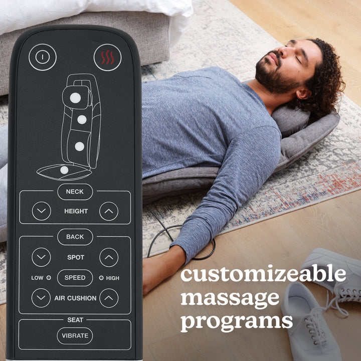 A man enjoying a massage with  Homedics Total Recline Shiatsu Massage Cushion with a view of the remote and different massage modes.