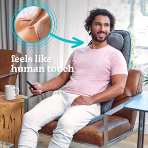 A man sitting up enjoying  Homedics Total Recline Shiatsu Massage Cushion. Feels like human touch.