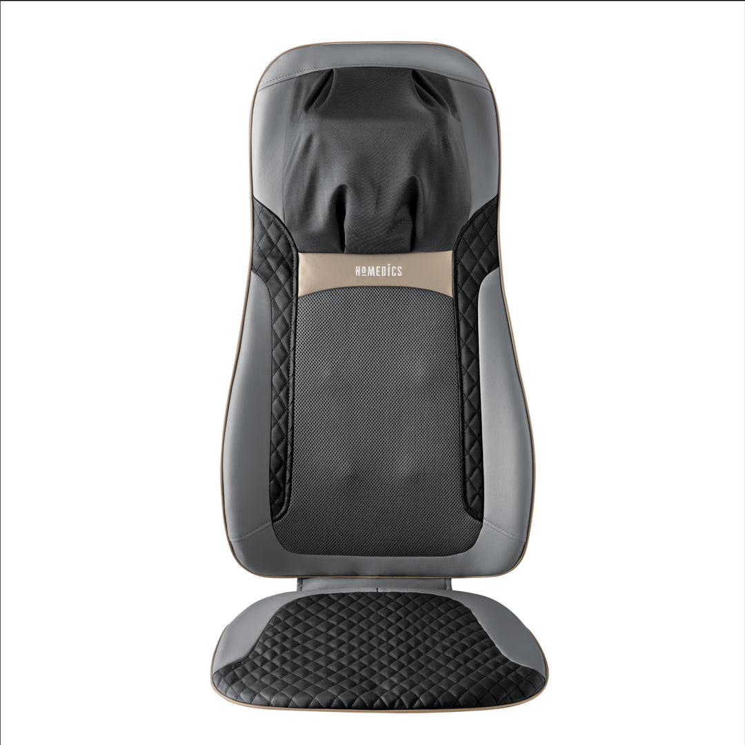 Woman in chair relaxes while enjoying a massage from the Homedics Shiatsu Elite II Massage Cushion with Soothing Heat