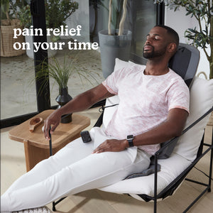 Man in chair relaxes while enjoying a massage from the Homedics Shiatsu Elite II Massage Cushion with Soothing Heat