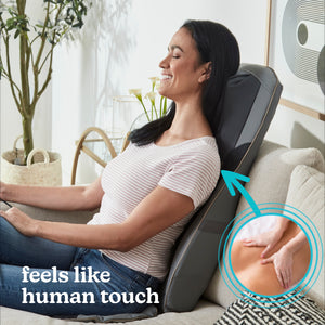 Woman in chair relaxes while enjoying a massage from the Homedics Shiatsu Elite II Massage Cushion with Soothing Heat