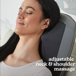 Woman in chair relaxes while enjoying a massage from the Homedics Shiatsu Elite II Massage Cushion with Soothing Heat